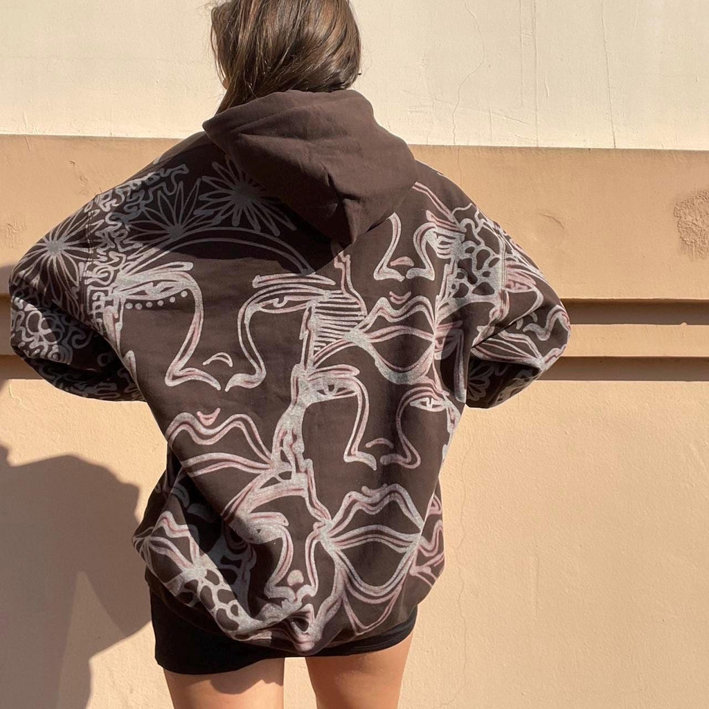 .Abstract faces, spotted mushroom clouds, and geometric cozy hoodie in dark chocolate brown and cream