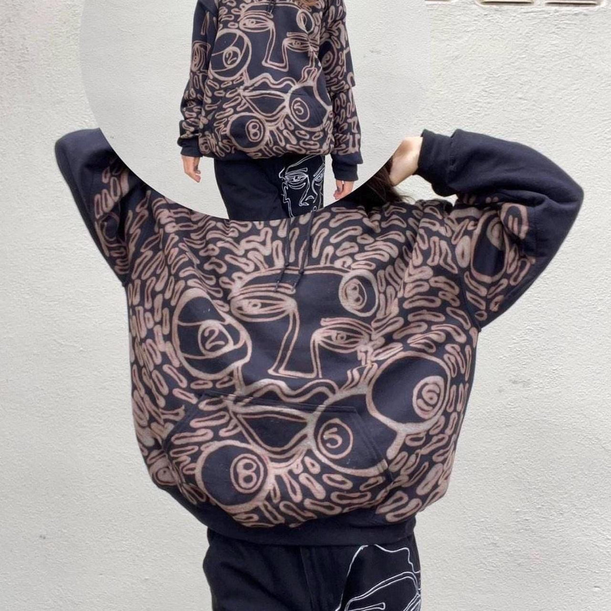 Faces and 8 ball pattern hoodie