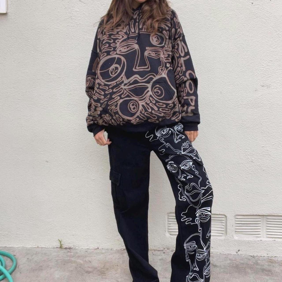Faces and 8 ball pattern hoodie