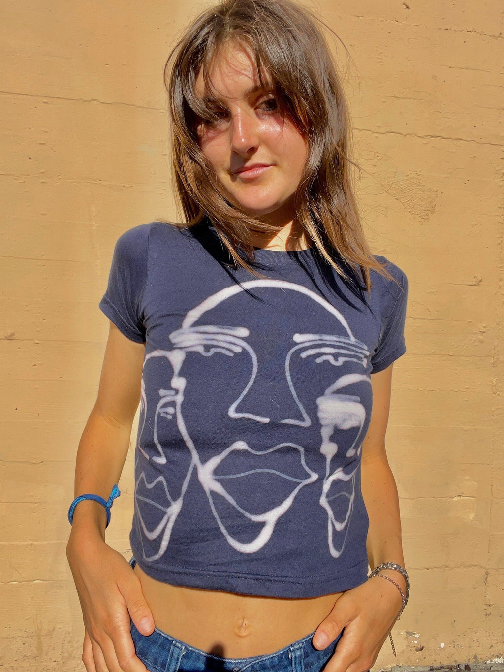 Various faces baby tees