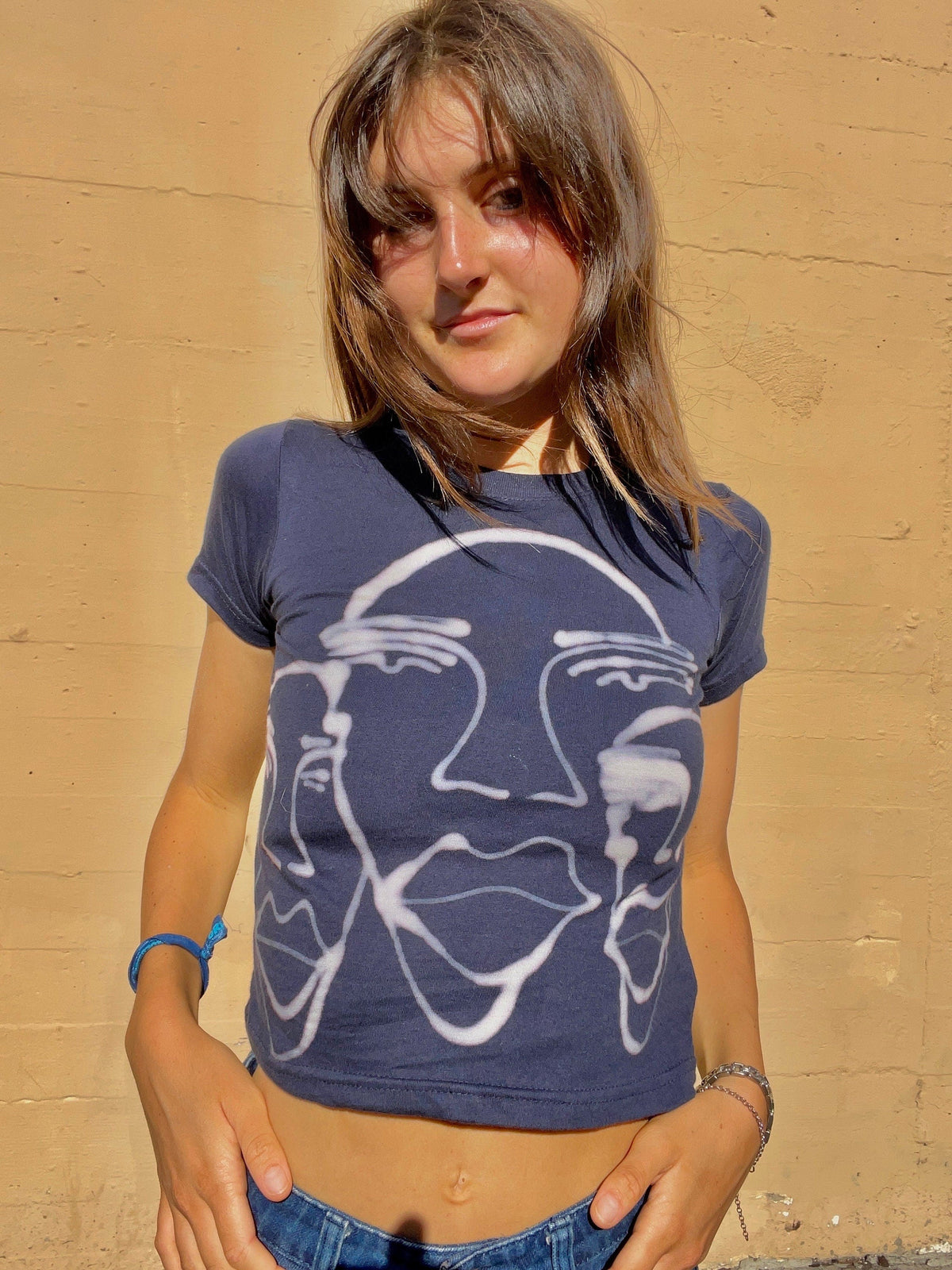 Various faces baby tees