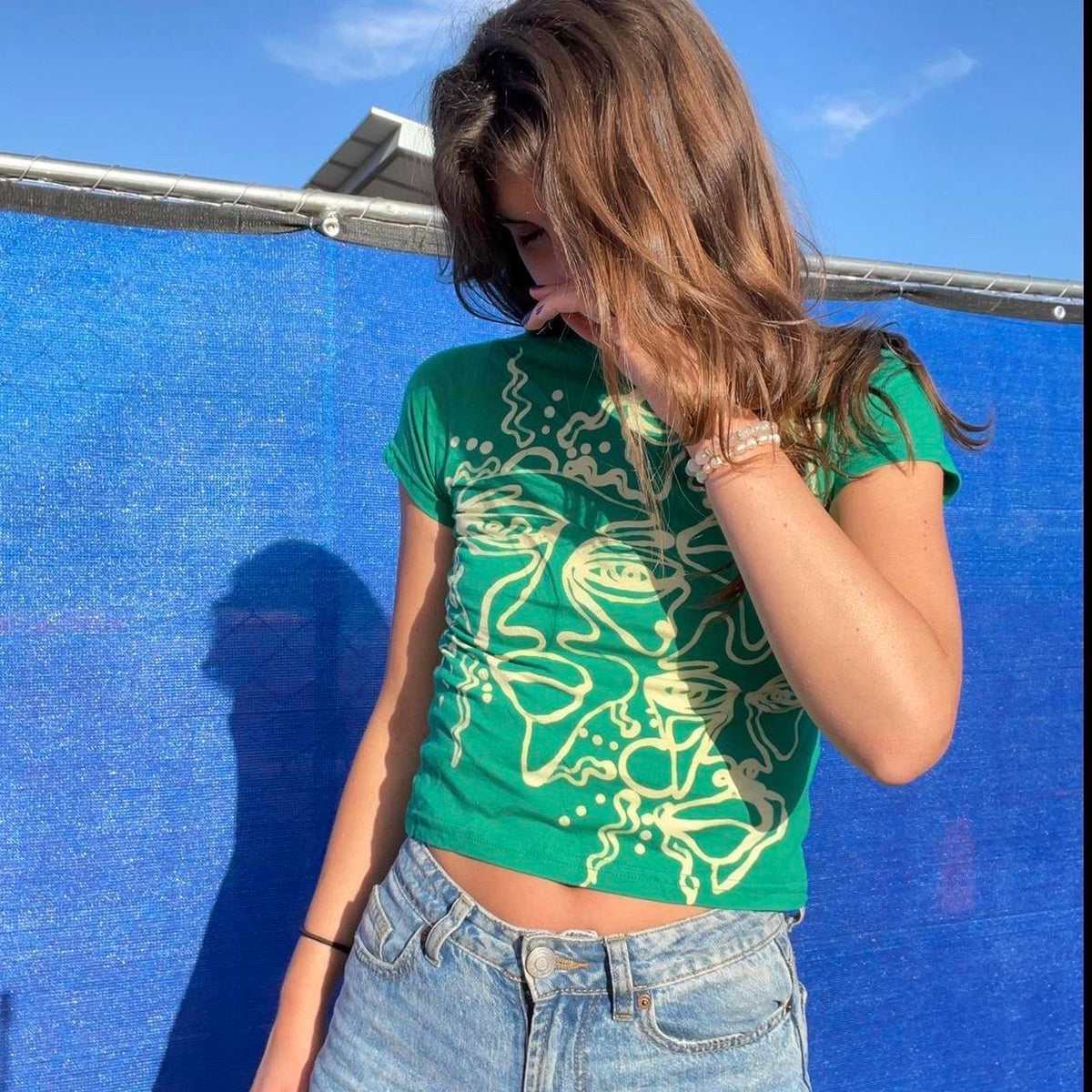 Psychedelic sun and faces patterns baby tee