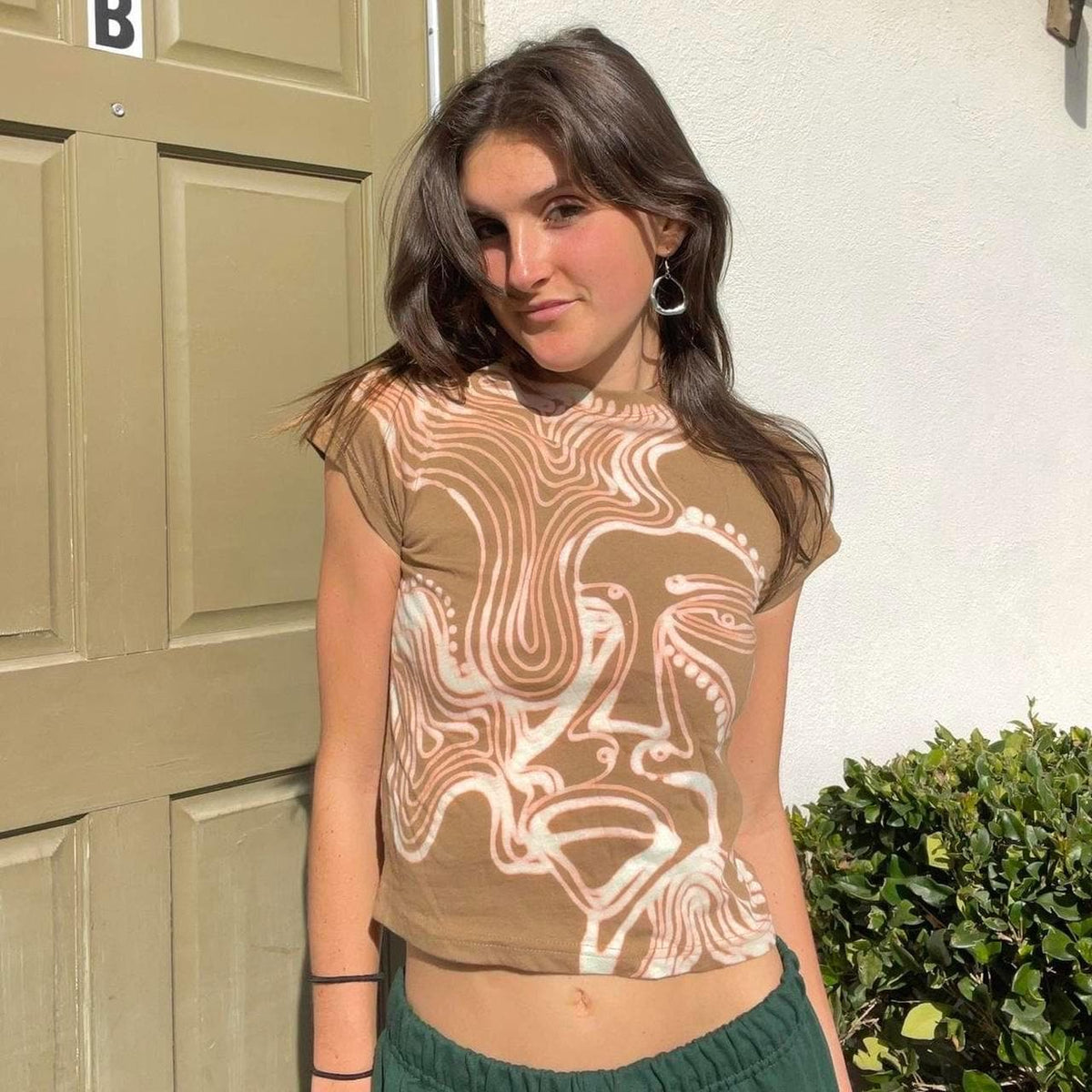 Psychedelic faces baby tee