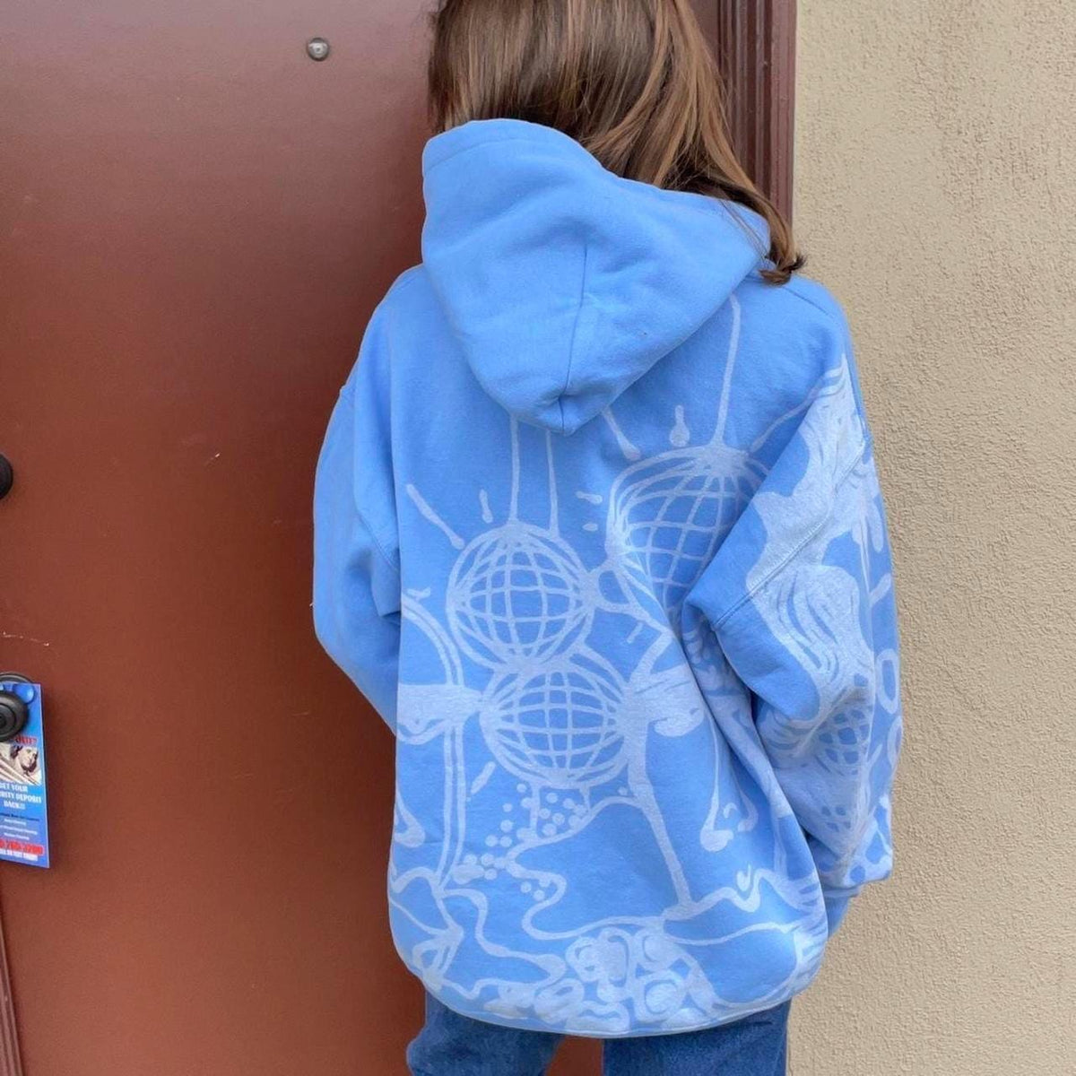 Abstract faces and unique print pastel blue hoodie
