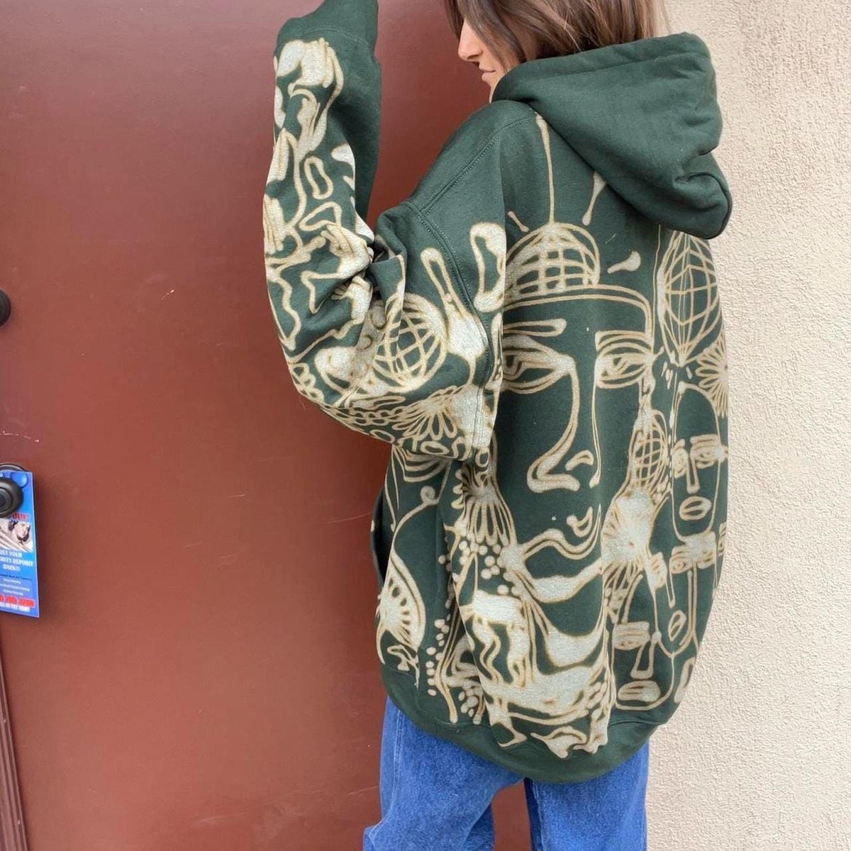 Graphic faces and trippy geometric patterned hoodie