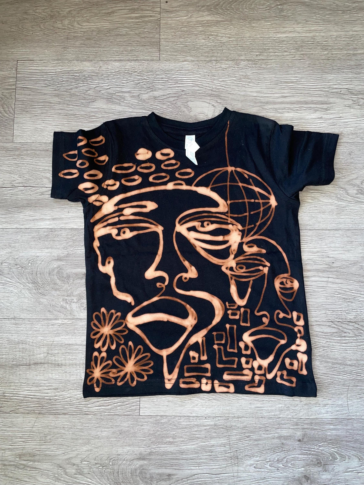 Overlapping faces baby tee