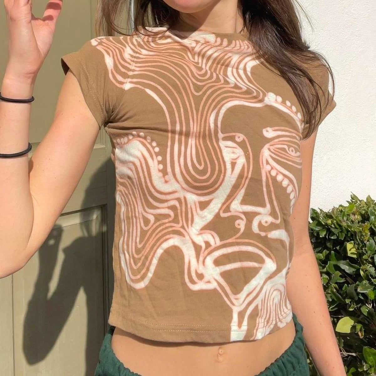 One line faces baby tee